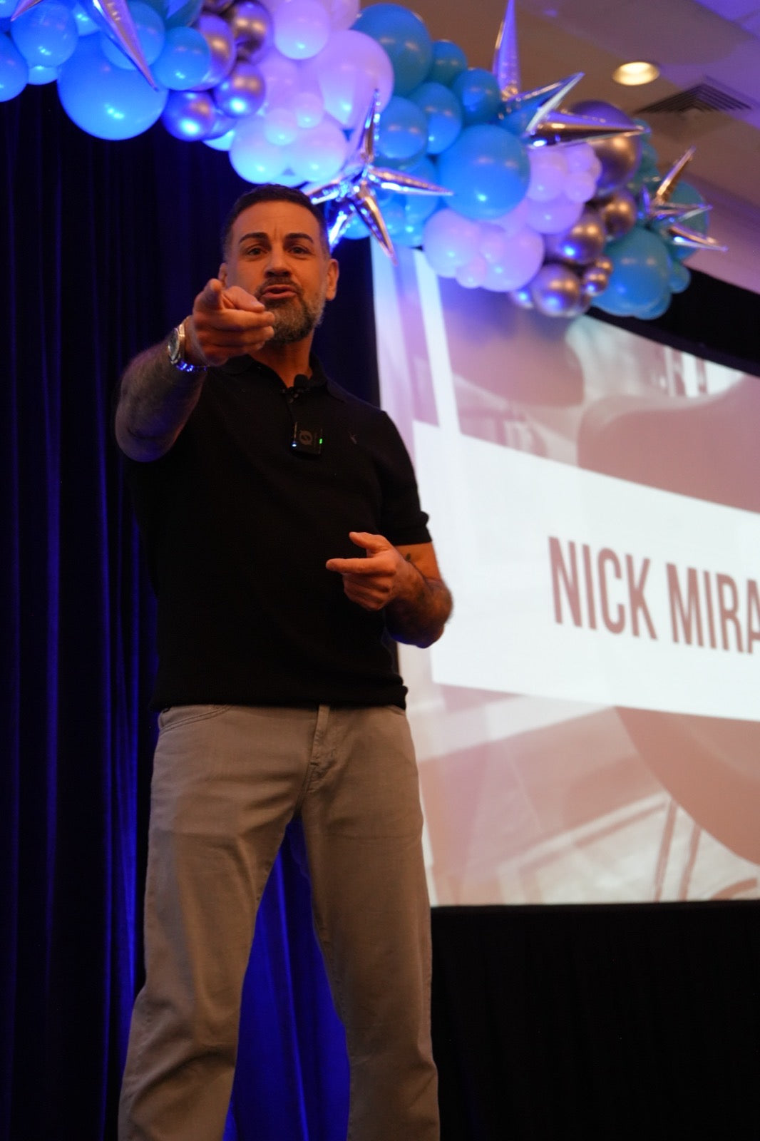 Nick Mirabella speaking to salon owners on stage